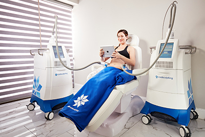 Women in CoolScultping chair - getting ready for treatment